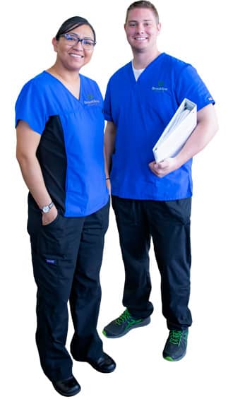 Male and Female nursing students in blue scrubs