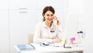 A Billing and Coding Specialist at her desk