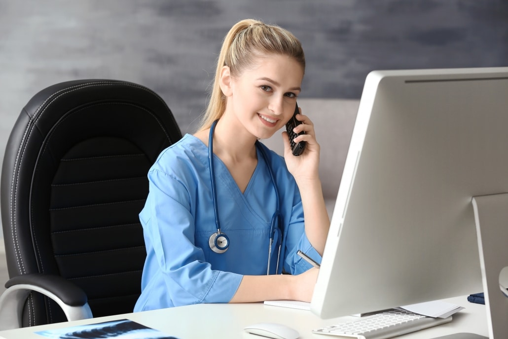 Smiling healthcare professional at a desk