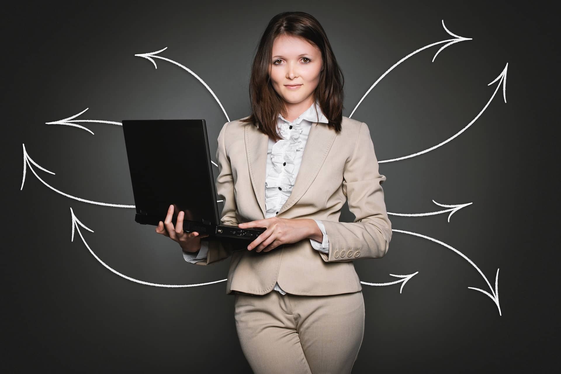 Professional woman holding a laptop