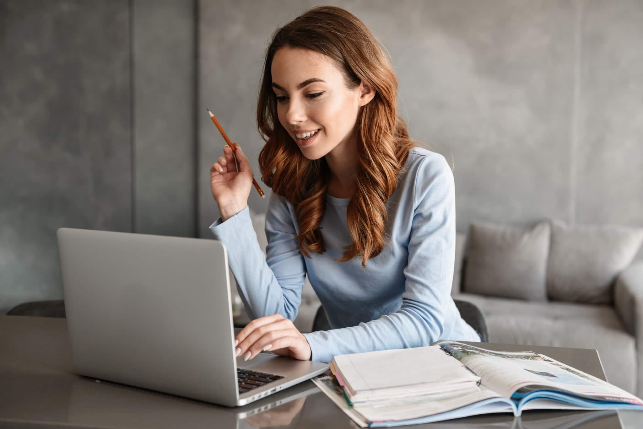 Smiling student on a laptop