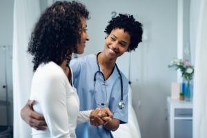 Healthcare worker assisting a patient