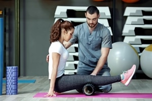 Physical Therapist Assistant helping a patient