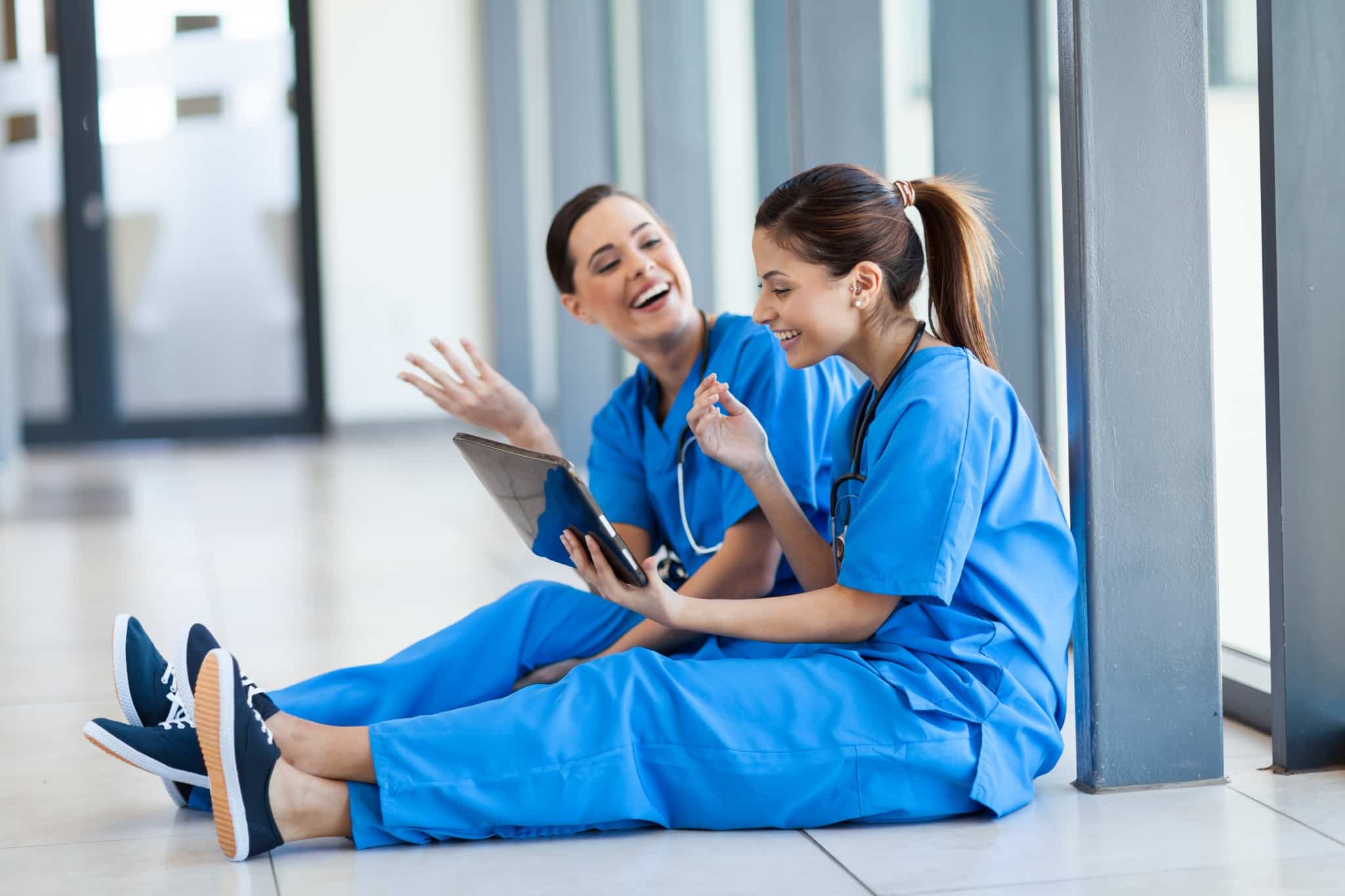 Nurses sitting in a hallway