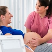 Midwife assisting a pregnant woman