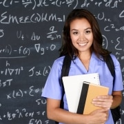 Medical student in front of a blackboard