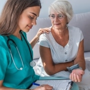 Female nurse with an elderly woman