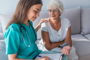 Female nurse with an elderly woman