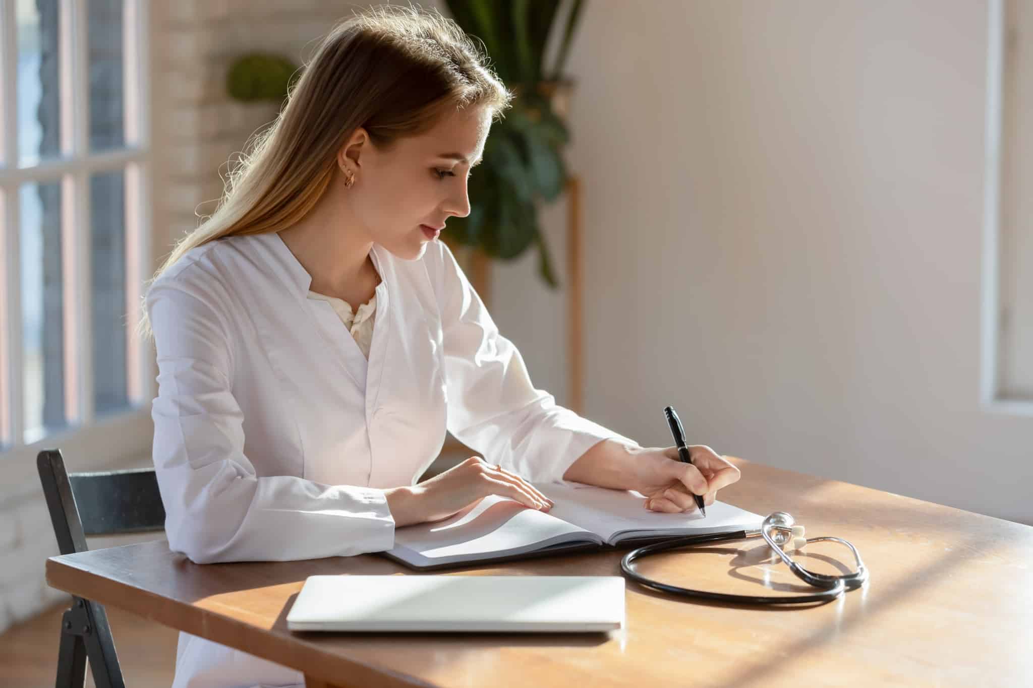 Medical professional taking notes
