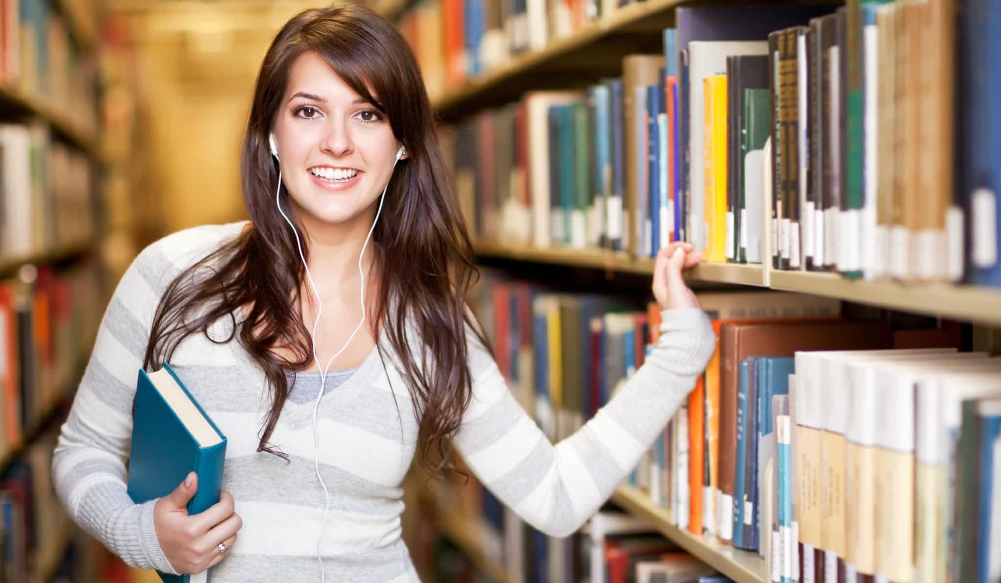 Woman smiling in a library