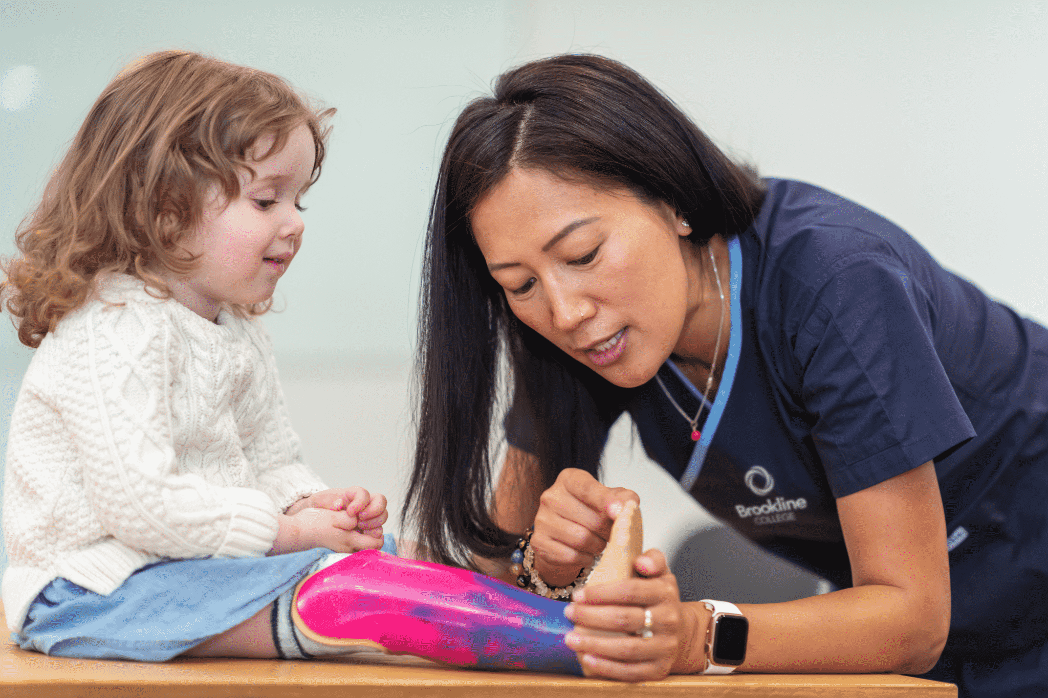Occupational therapist assists child