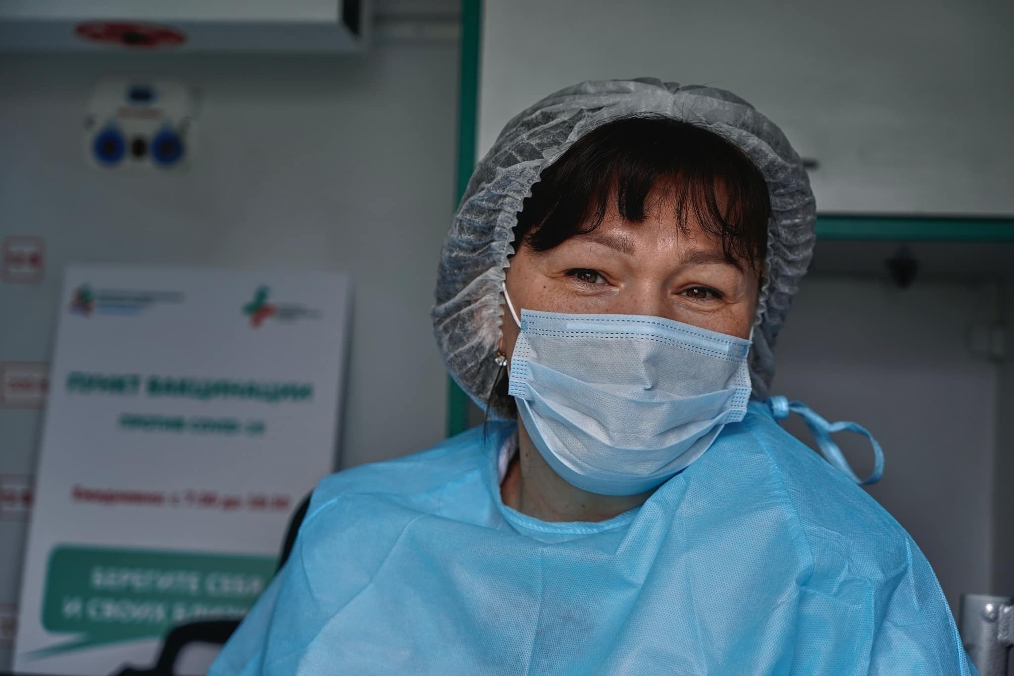Nurse in scrubs and a mask