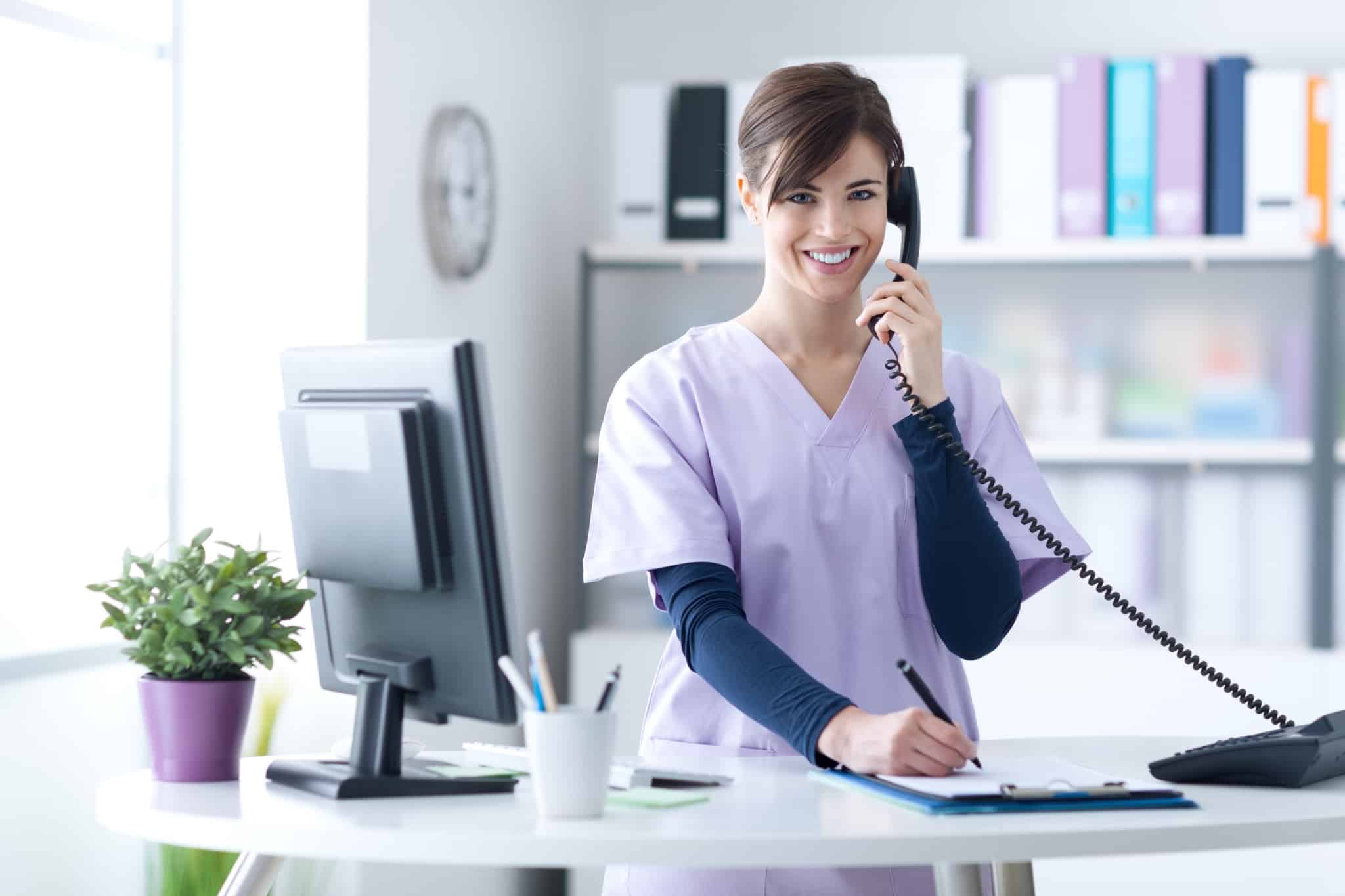 Medical professional on an office phone