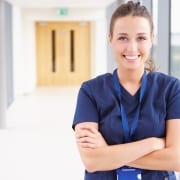 Smiling healthcare professional with arms crossed