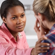 African-American professional counseling a patient