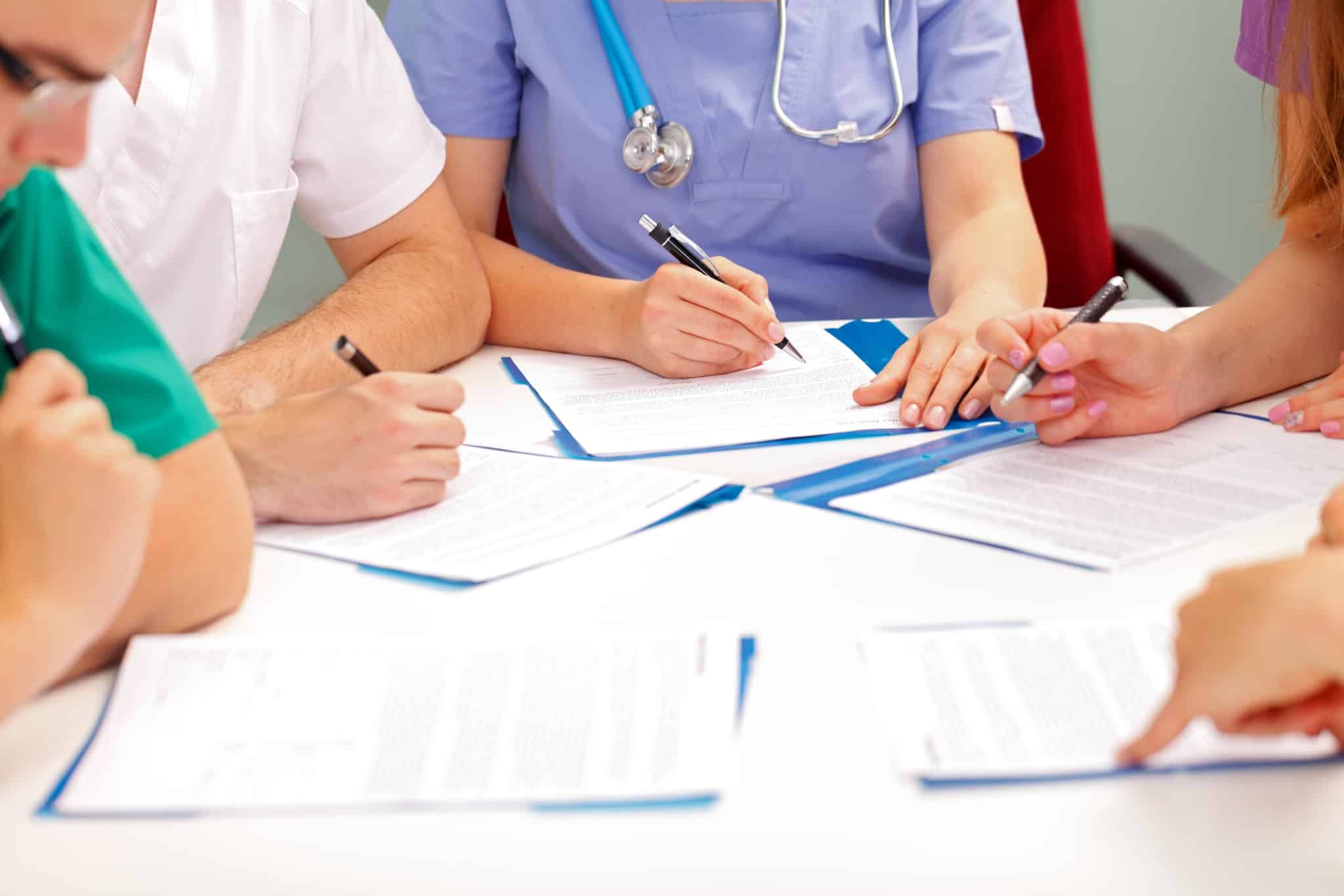 Medical team filling out paperwork
