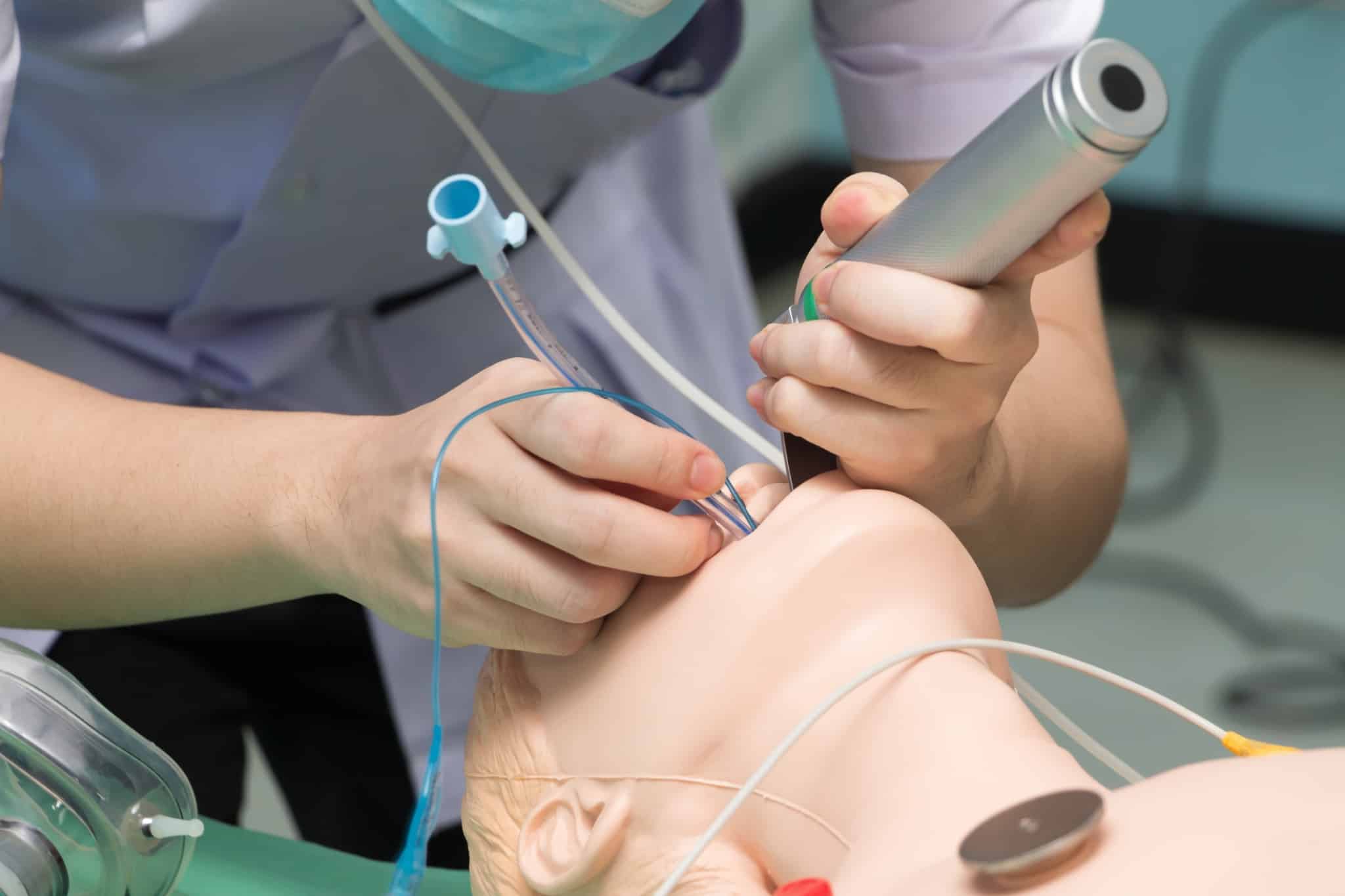 Anesthesiologist performing an intubation