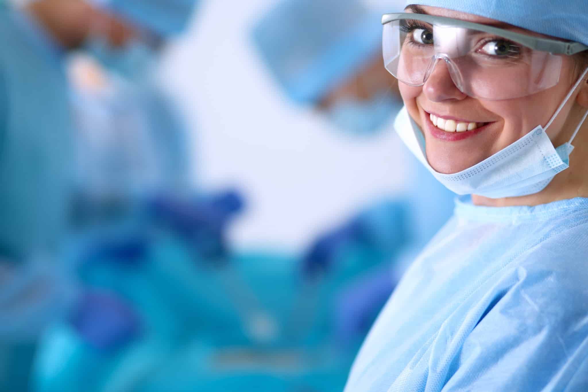 Close up of smiling woman in the operating room