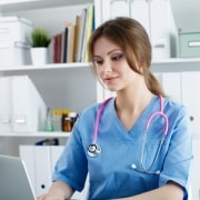 Female healthcare professional on a laptop