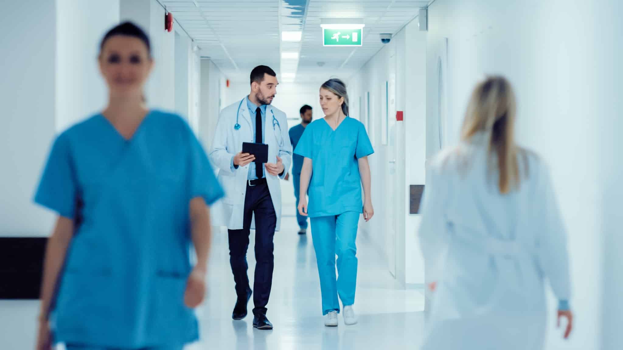Medical professionals in a hospital hallway