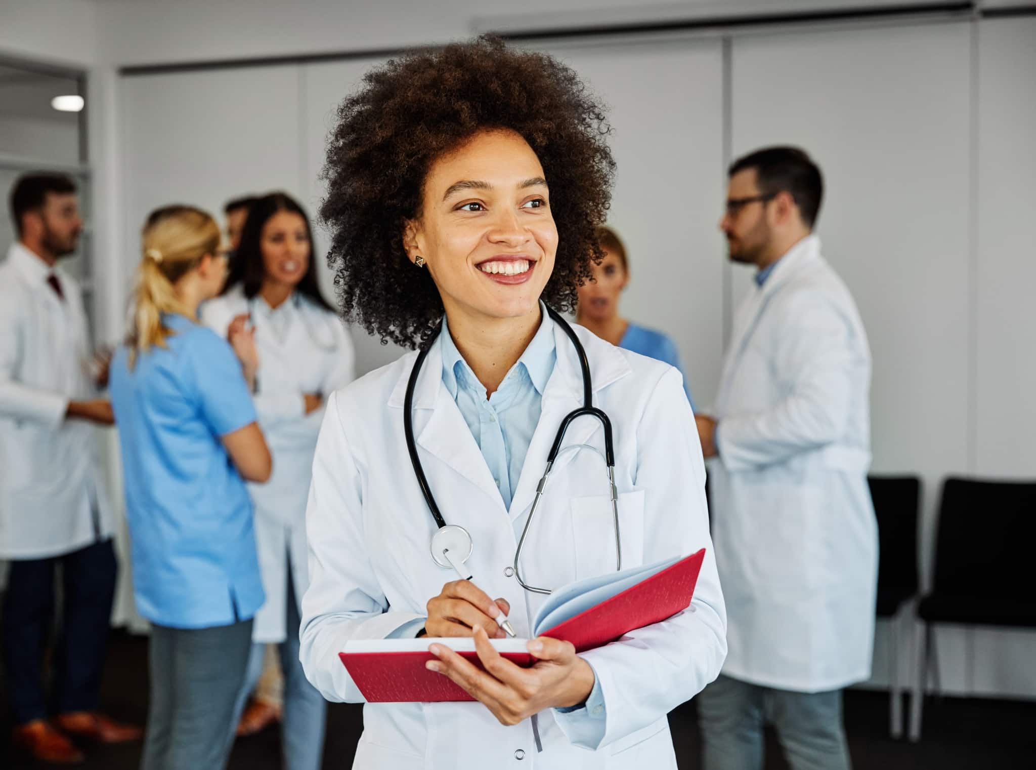 Young doctor in front of a medical team