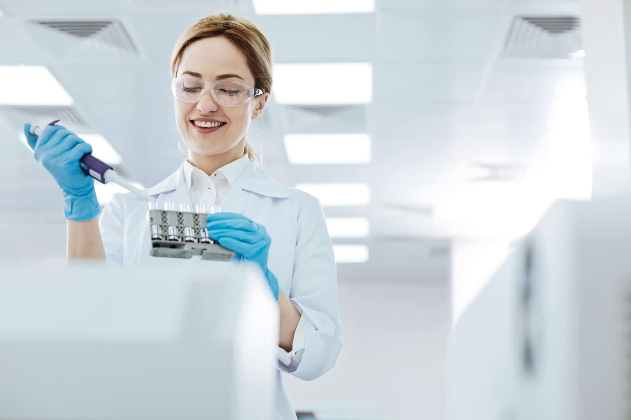 Female scientist taking test samples