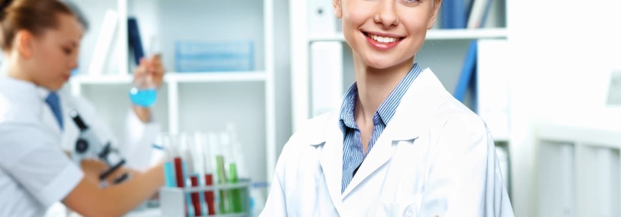 Smiling female scientist in a lab coat