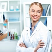 Smiling female scientist in a lab coat