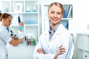 Smiling female scientist in a lab coat