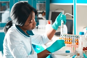 African scientist performs tests in a lab