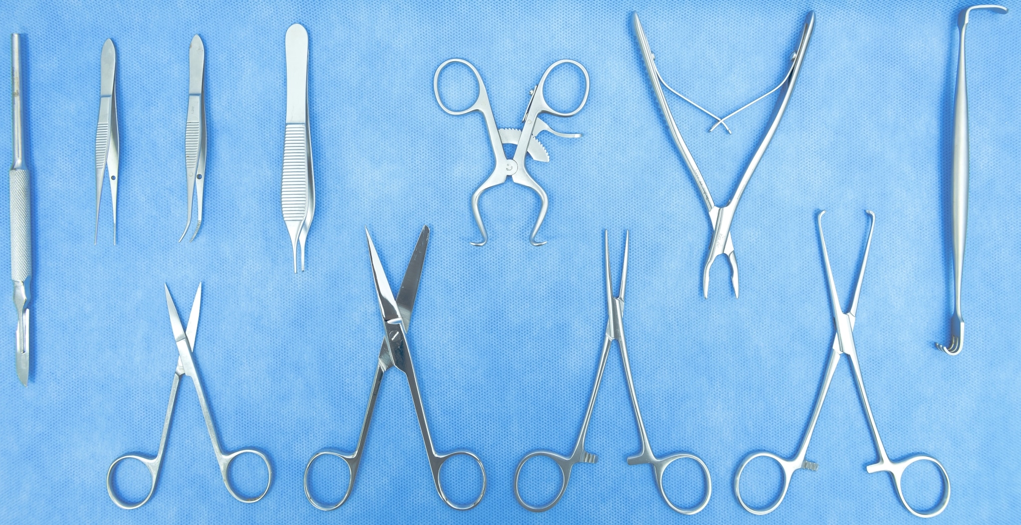 Sterilized surgical instruments on a blue background