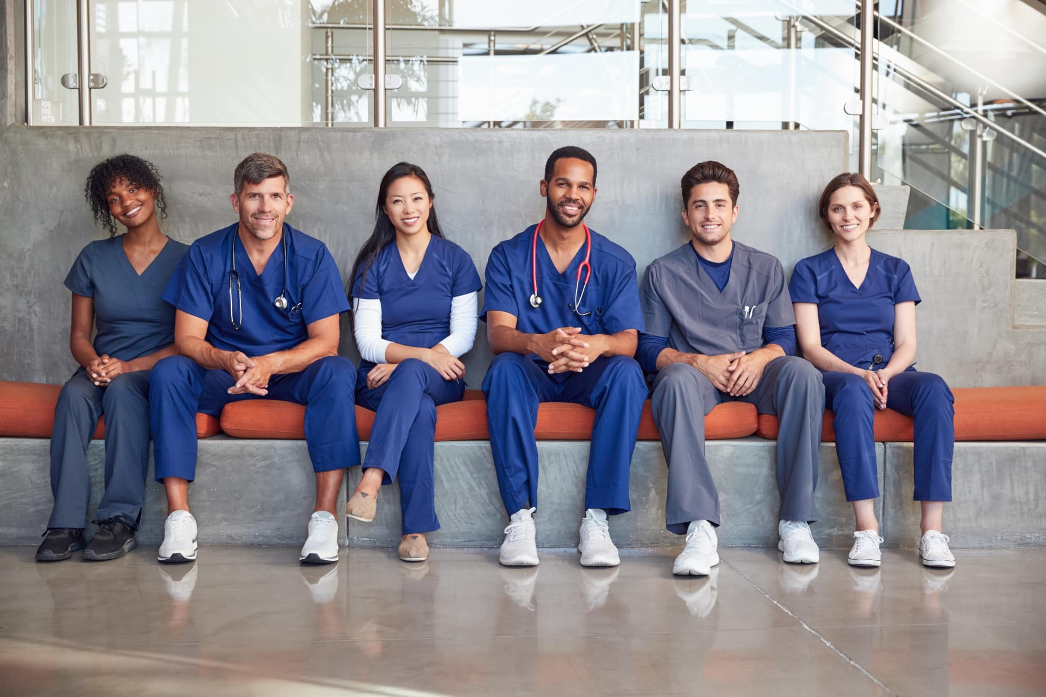 Group of healthcare workers sitting in a hospital