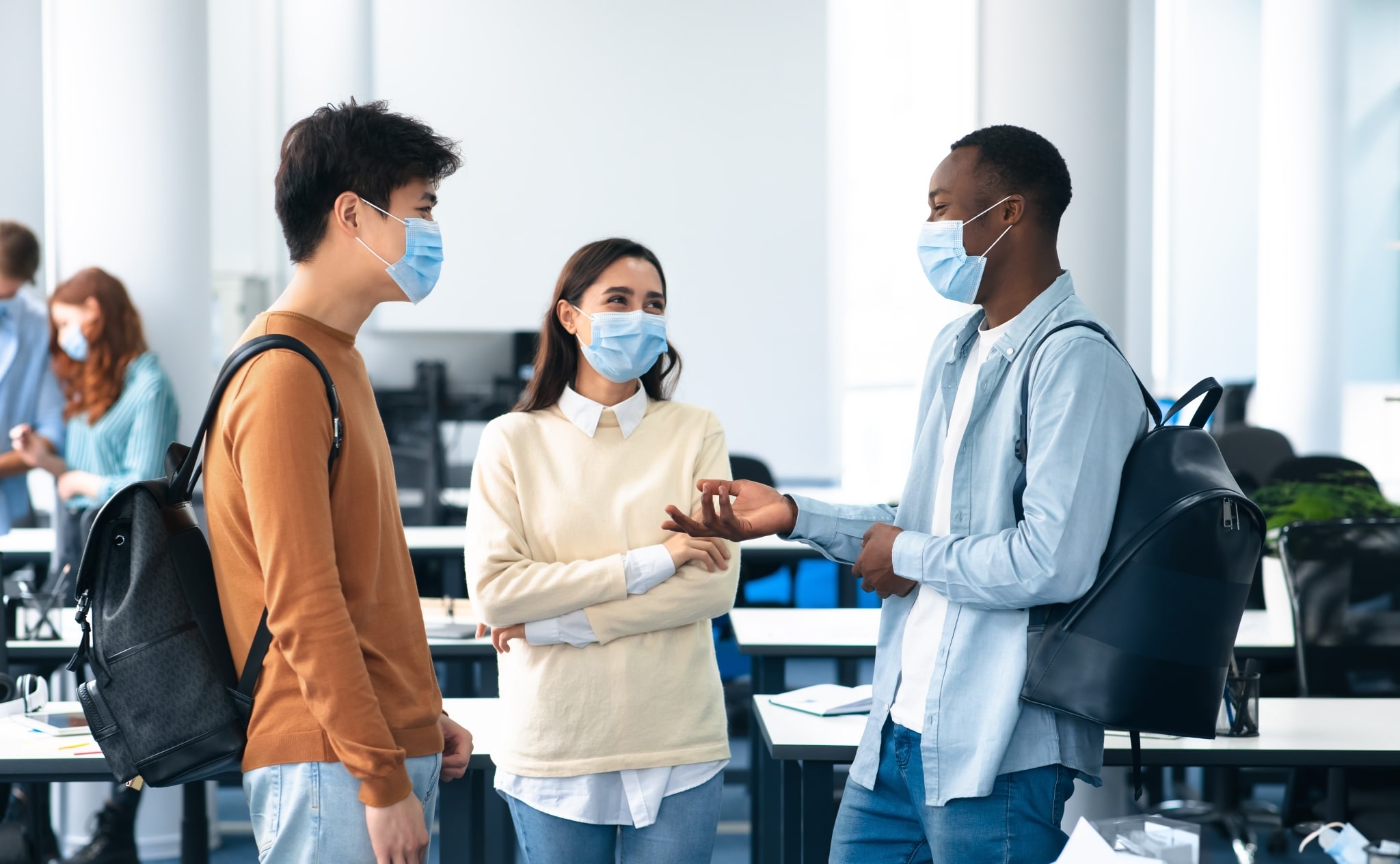 Group of adult students wearing masks