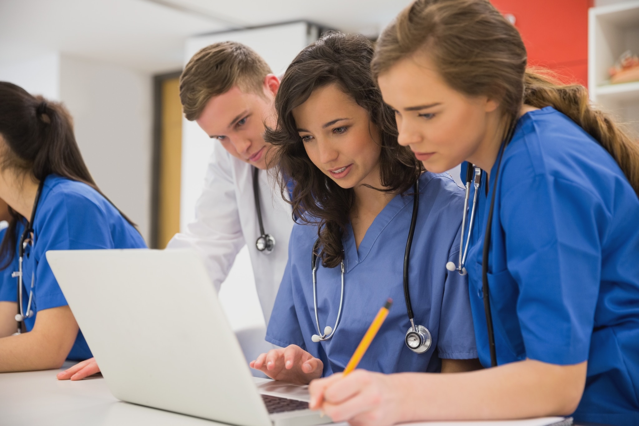 Group of medical students using a laptop