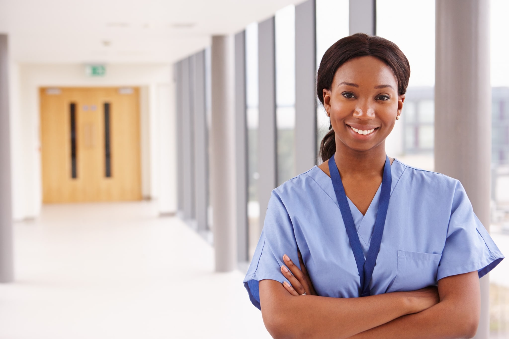 Female healthcare worker in a hospital corridor