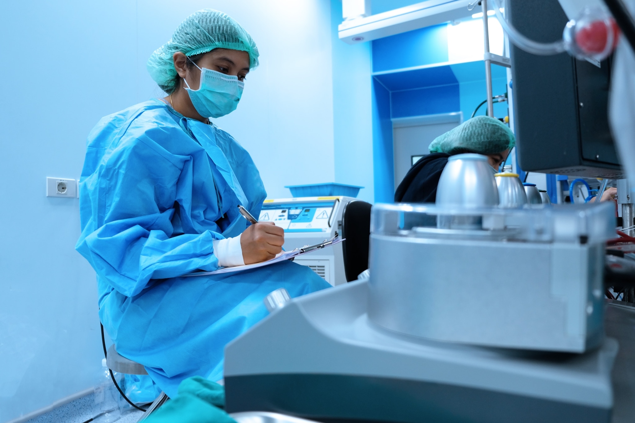 Medical professional filling out paperwork