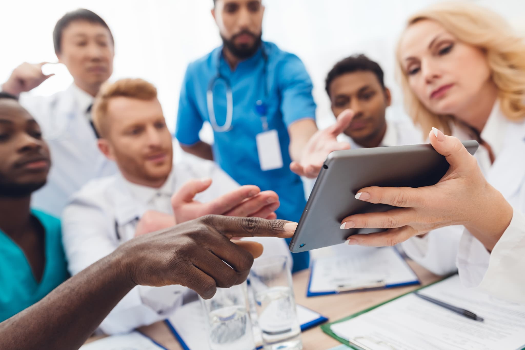 Close up of a medical group using a tablet