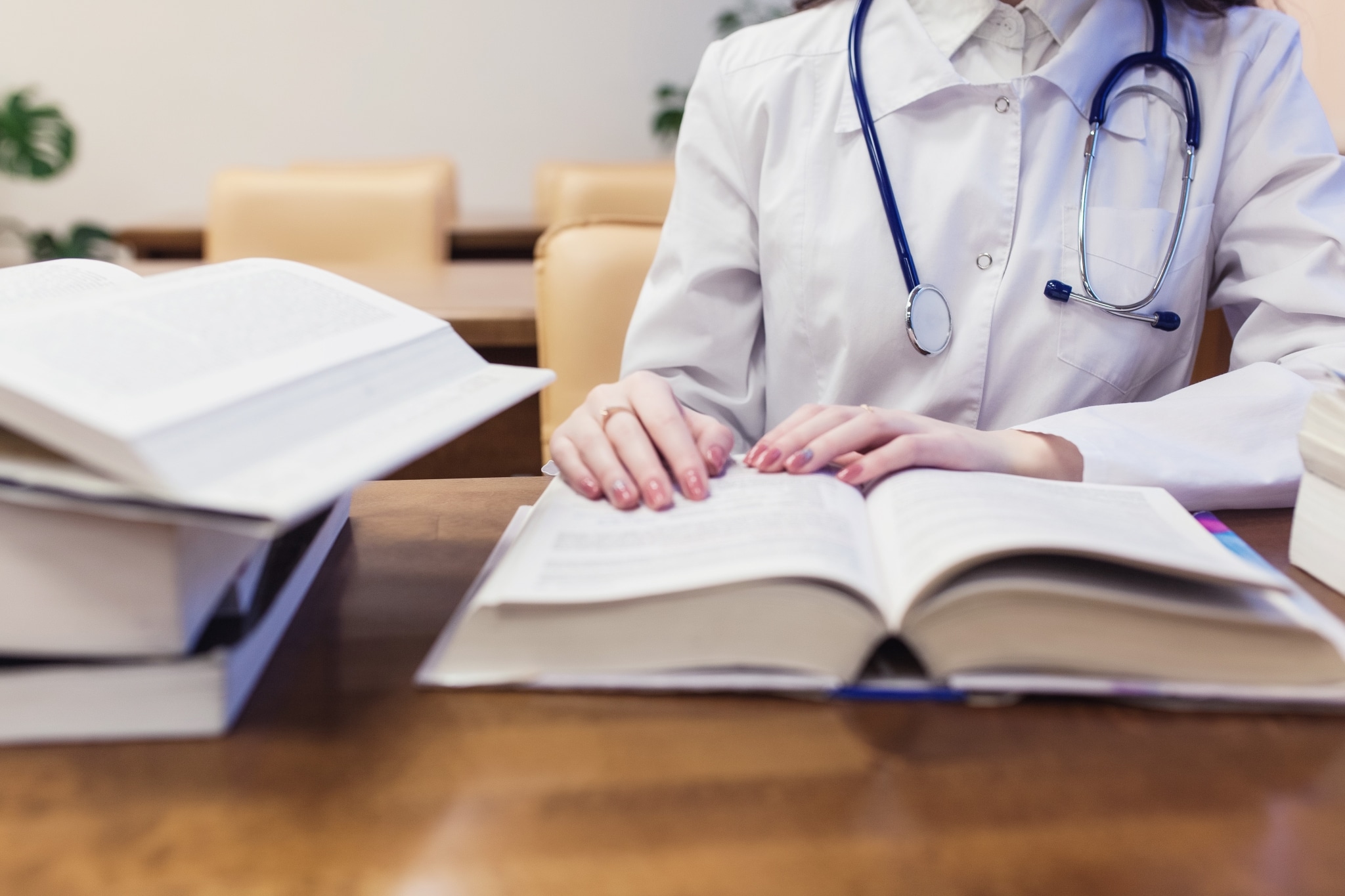 Close up of a medical student with textbooks
