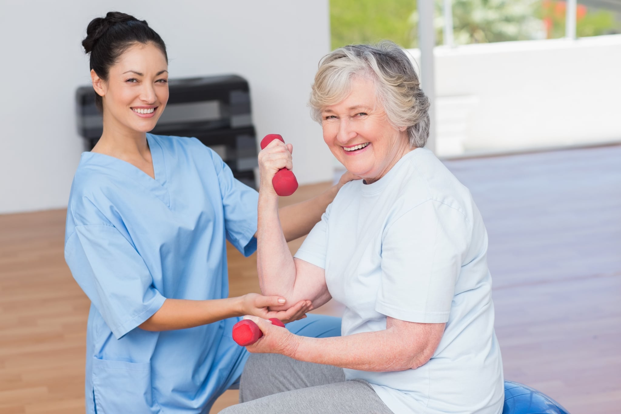 Young nurse assisting a senior woman
