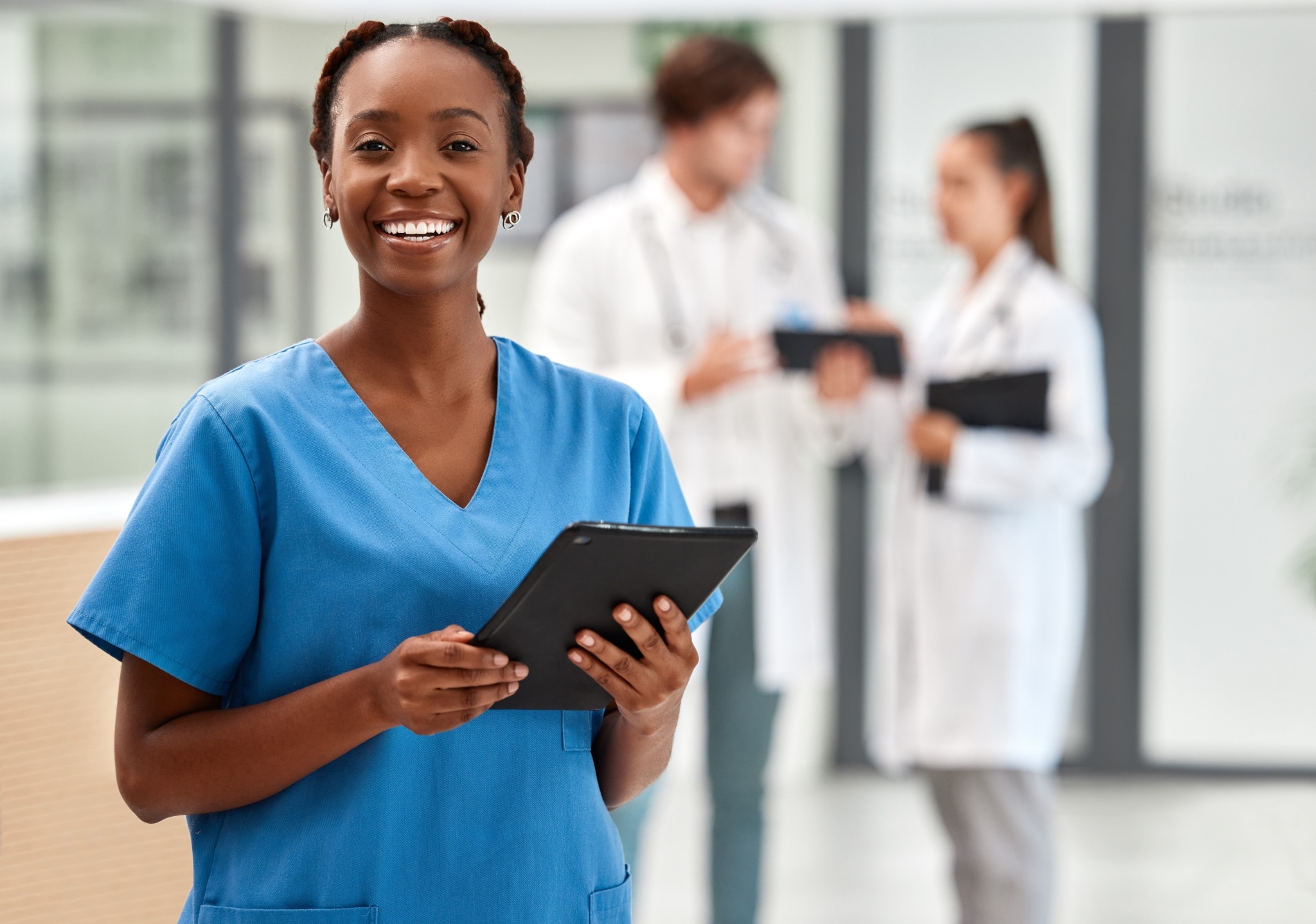 Smiling African-American nurse with a clipboard