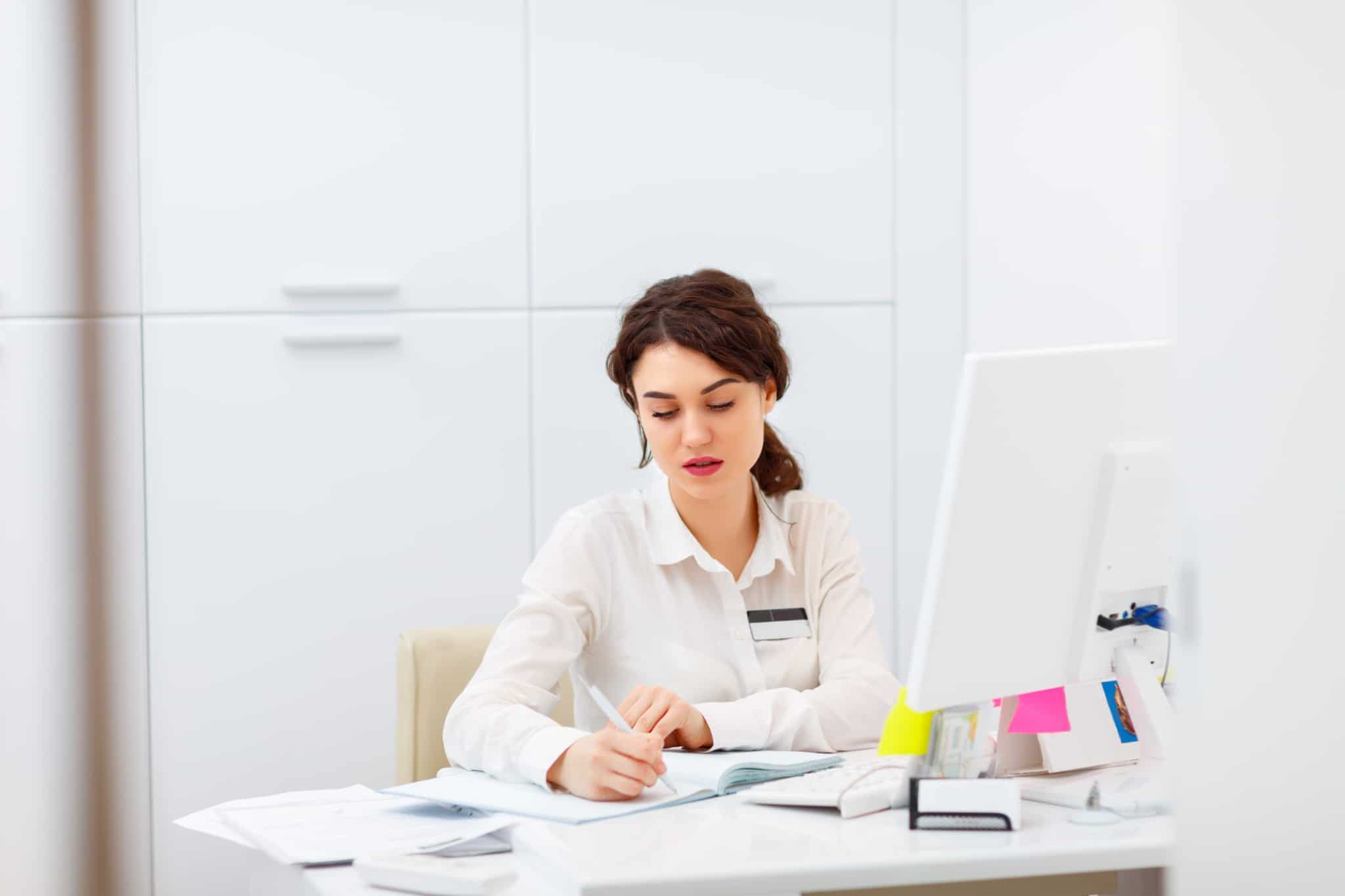 Young medical professional working at a desk