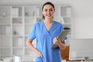 Medical Assistant with a clipboard at a clinic