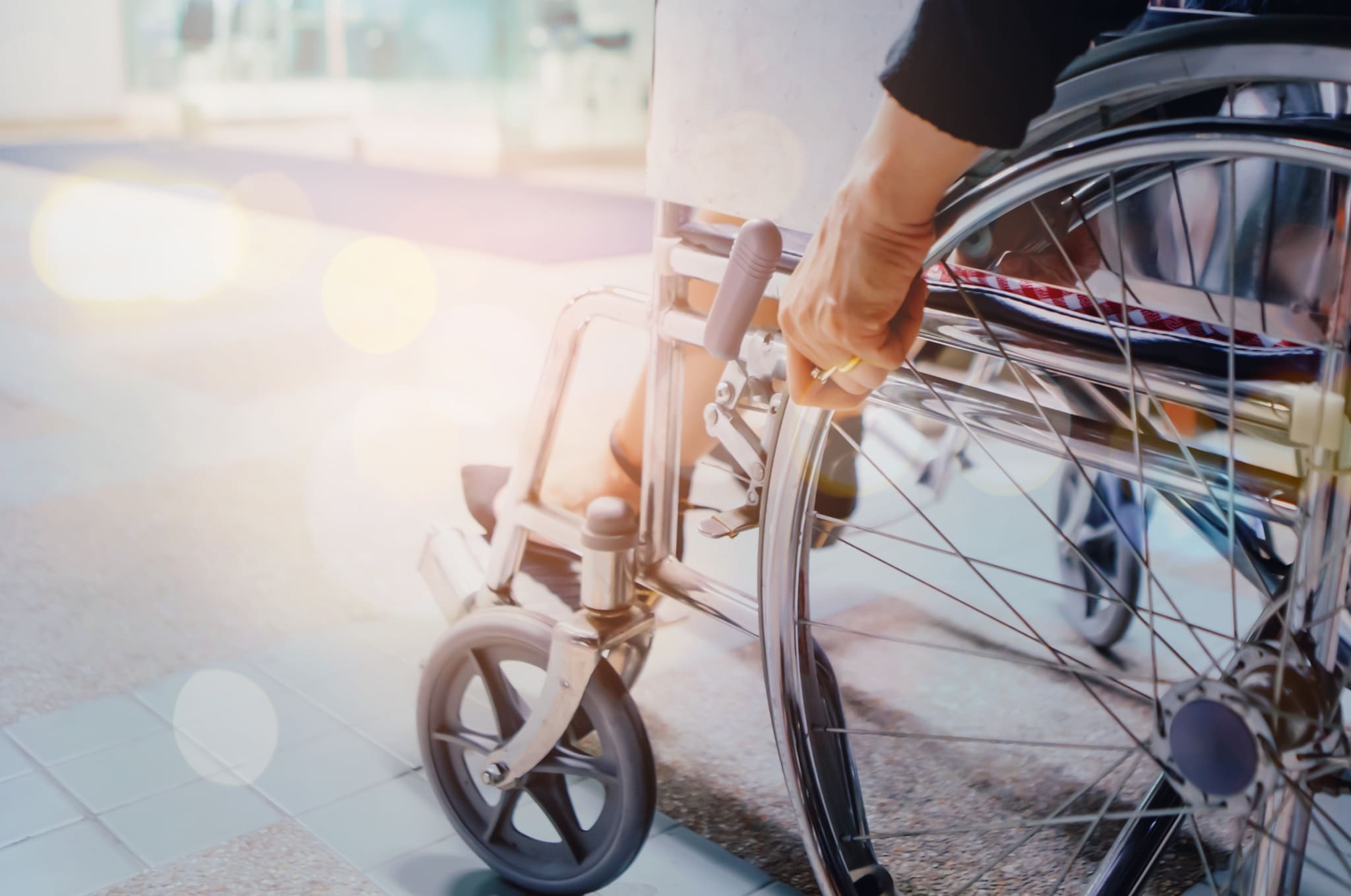 Close up of a patient using a wheelchair