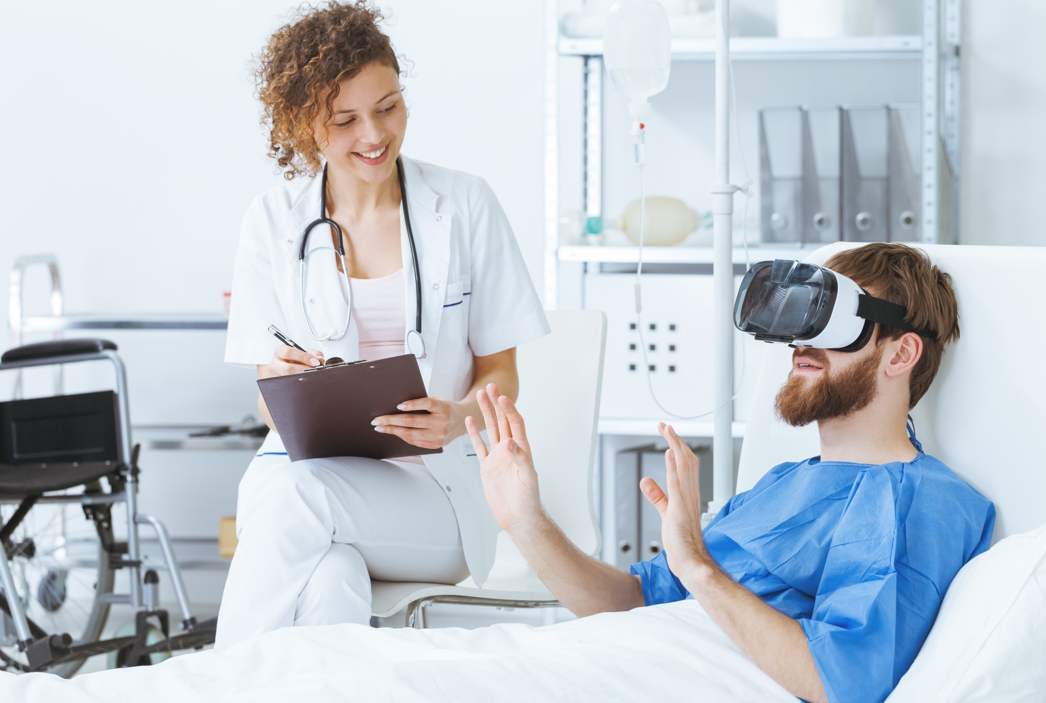 Psychiatric professional with a patient using a virtual-reality headset