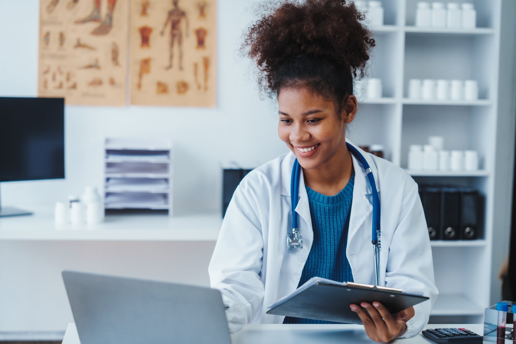 African-American medical professional using a laptop