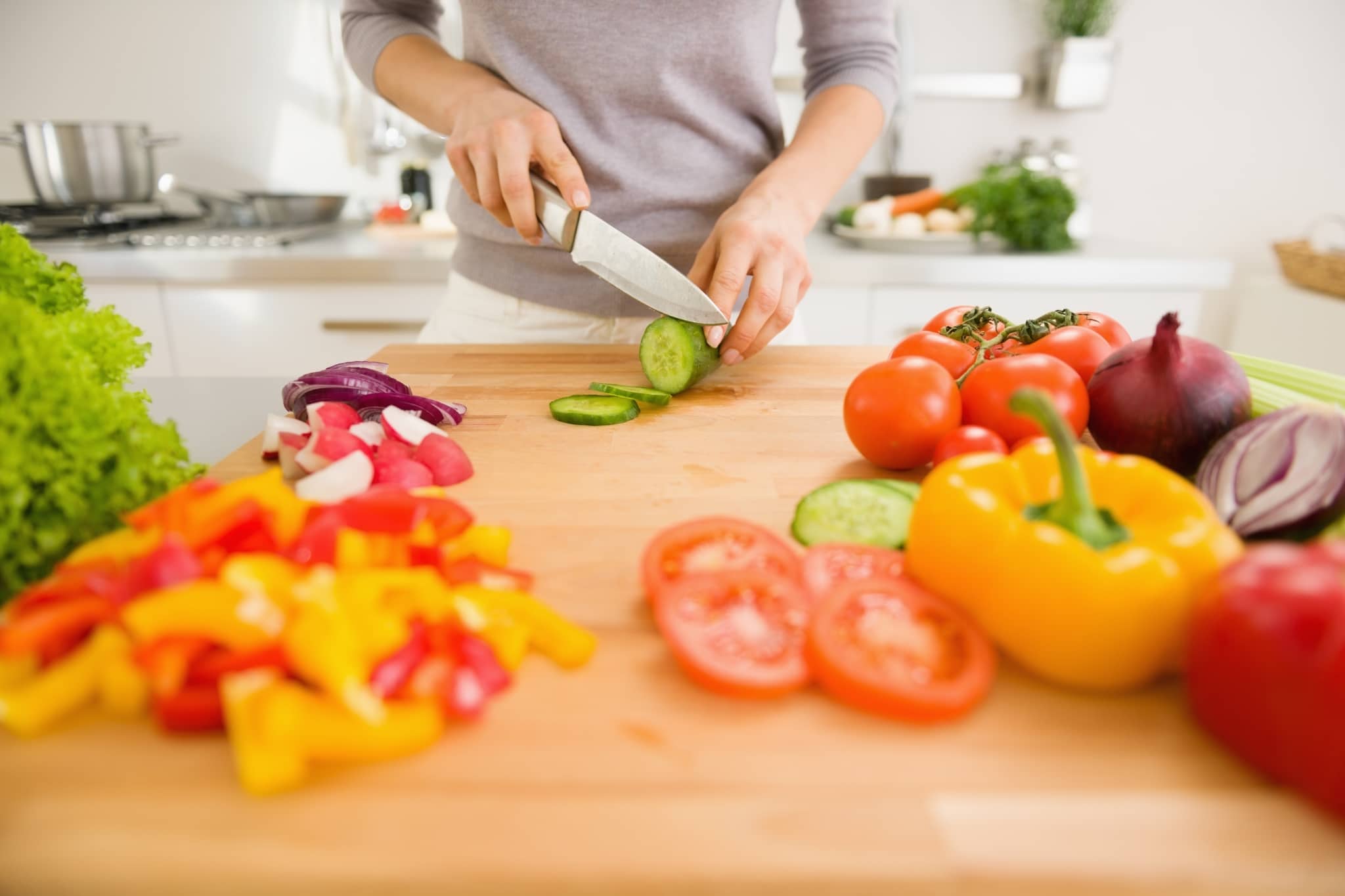 Close up of a person chopping vegetables