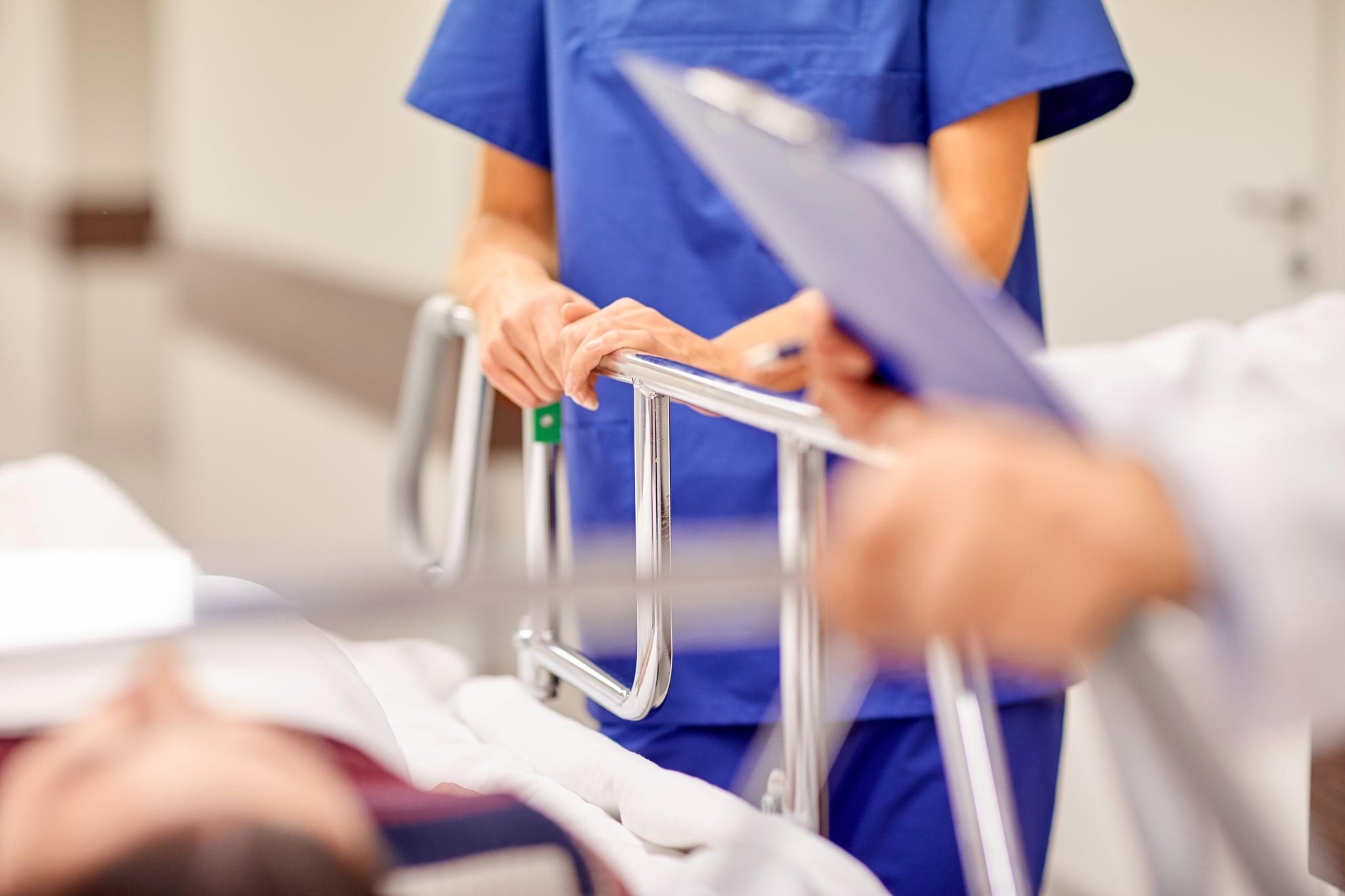 Close up of a woman at a patient's bedside