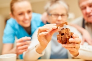 Close up of an elderly woman in an occupational therapy session