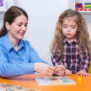 Occupational Therapy Assistant with a young child in a session