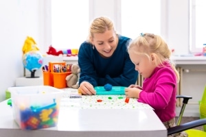 Occupational therapy professional with a pediatric patient